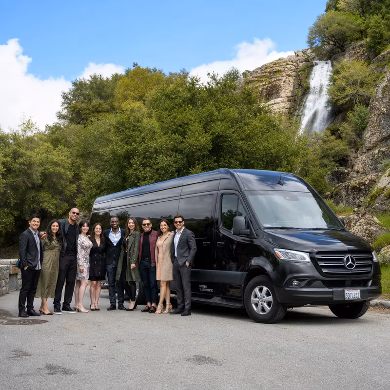 Group beside a Mercedes Sprinter limo from the Freemont fleet