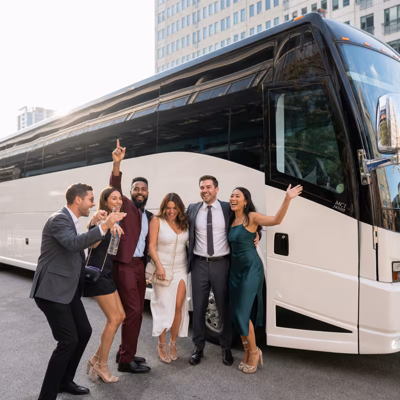 Passengers loading luggage while boarding an Freemont group shuttle