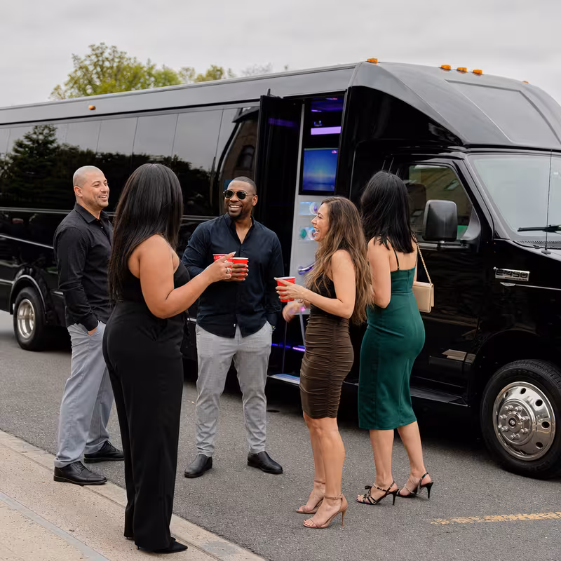 Passengers loading luggage while boarding an Freemont group shuttle