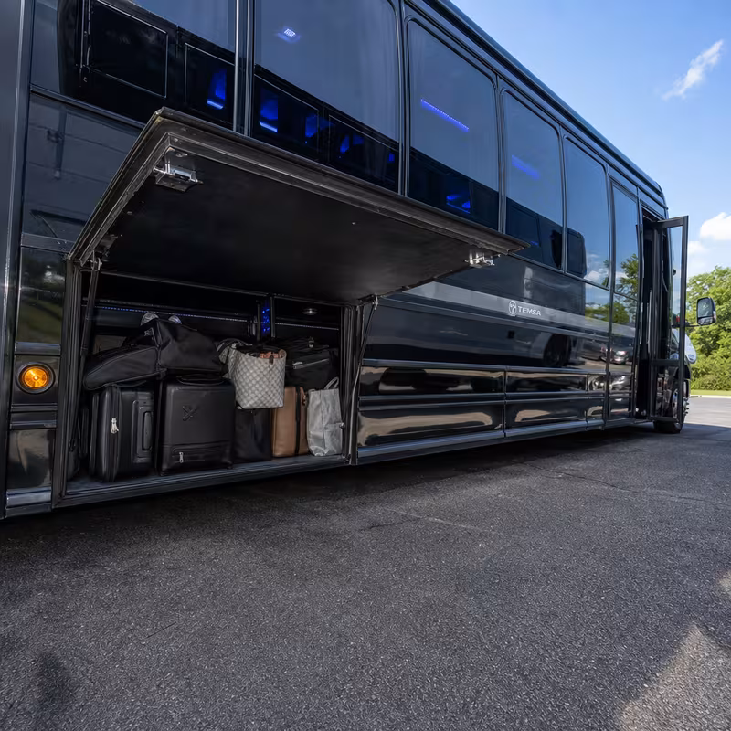 Party bus interior with wraparound leather seating and LED lighting in Freemont