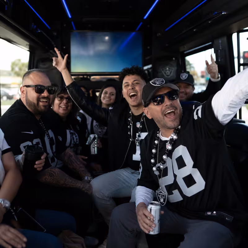 Group boarding a white charter bus for Sporting Event Transportation transportation in Freemont