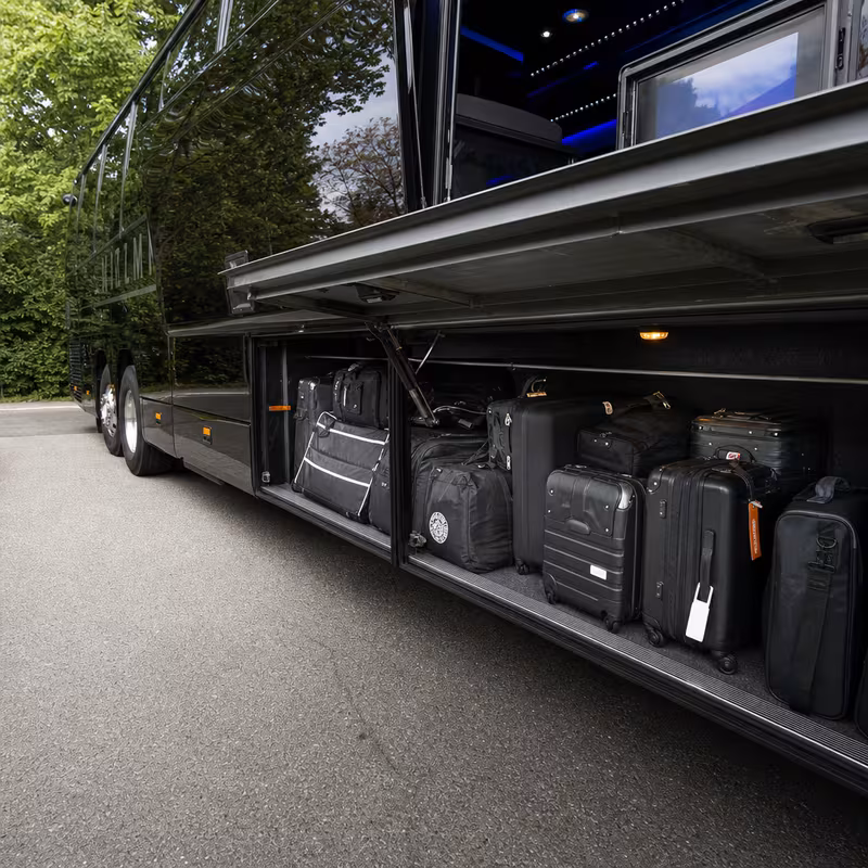 Party bus interior with wraparound leather seating and LED lighting in Freemont